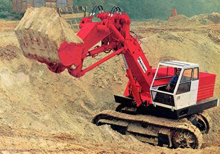 Early hydraulic excavator on a job site